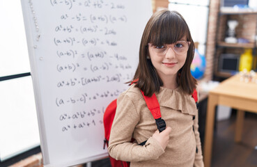 Poster - Adorable hispanic girl student smiling confident standing at classroom