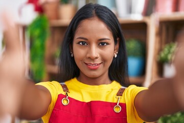 Canvas Print - Young beautiful woman florist smiling confident make selfie by camera at florist