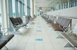 © Nina L/peopleimages.com - Empty lounge space in airport with chair, waiting room and global travel of covid regulations. Immigration lobby, seat or building interior design for transportation, furniture and clean backgrounds