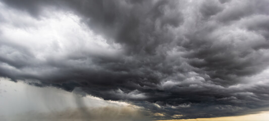 Aufkleber - The dark sky with heavy clouds converging and a violent storm before the rain.Bad or moody weather sky and environment. carbon dioxide emissions, greenhouse effect, global warming, climate change