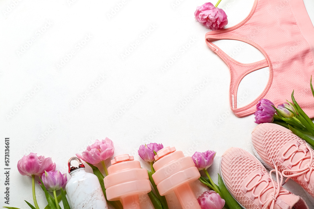 Sports equipment with tulips on white background. Hello spring