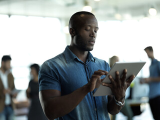 Poster - Technology, internet and black man with tablet reading email, sales or social media on web. Research, leadership and company ceo networking with online communication in management at startup office.