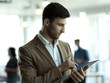 © Yuri Arcurs/peopleimages.com - Technology, communication and businessman with tablet reading email, sales report or company website in office. Research, leadership and networking, online schedule management app at startup agency.