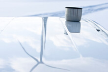 A Wind Turbine Reflected In The Metal Of A Vehicle Near Goscino, Poland.