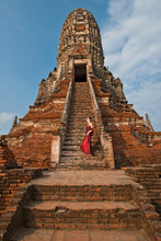 Woman In Red Dress At The Ancient Temple Of Wat Chaiwatthanaram In Ayutthaya