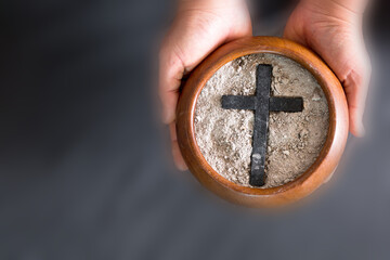 Ashes in hand are prepared for Christian festival of apostles. dust symbol of religion, sacrifice, redemption, Jesus Christ, ash wednesday, lent, Good Friday, Easter with Church is devoted to fasting