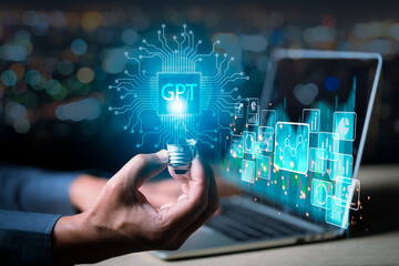 ChatGPT Chat with AI or Artificial Intelligence. Young businessman chatting with a smart AI or artificial intelligence using an artificial intelligence chatbot developed by OpenAI.