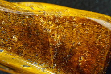 Natural mineral stone tiger eye gemstone. Close up, macro