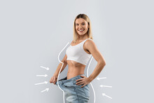 Happy Blonde Lady In Jeans, Showing Loose In Waist