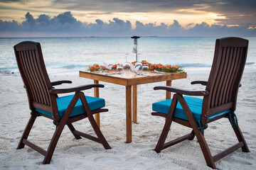 Wall Mural - romantic dinner table setting on sunset beach