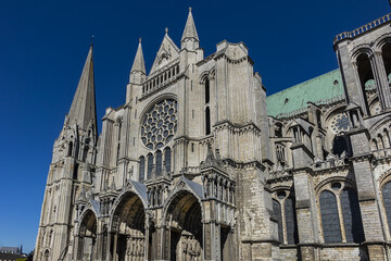 Wall Mural - Architectural fragments of Roman Catholic Chartres Cathedral or Cathedral of Our Lady of Chartres (Cathedrale Notre Dame de Chartres, 1220). Chartres (80 km southwest of Paris), Eure-et-Loir, France.