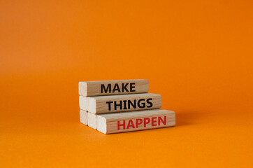 Wall Mural - Make things happen symbol. Concept word Make things happen on wooden blocks. Beautiful orange background. Business and Make things happen concept. Copy space