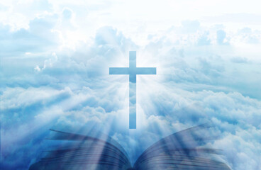 Wall Mural - Christian cross with open book on the blue sky Double exposure stylish