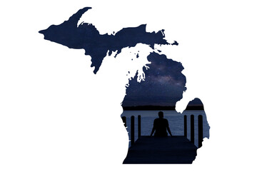 Wall Mural - Outline of the state of Michigan with a boy sitting on a dock stargazing at night. 