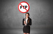 © ra2 studio - Young business person holdig traffic sign