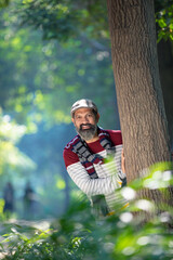 Wall Mural - Indian man giving expression at park.