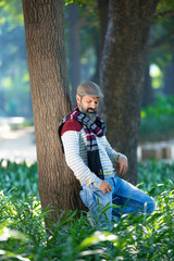 Wall Mural - Indian man giving expression at park.