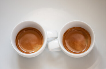 2 Espressos in white cups, white background