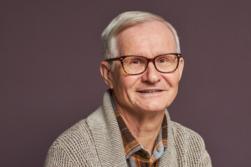 Senior man with white hair in eyeglasses
