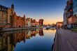 © Westend61 - Reflection of old town in Motlawa river at sunrise