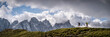 © Westend61 - Man and woman hiking under cloudy sky at Forcella Venegia, Dolomites, Italy