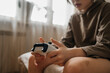 © Westend61 - Boy sitting on bed with controller at home