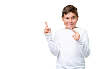 Wall Mural - Little caucasian kid over isolated chroma key background frightened and pointing to the side