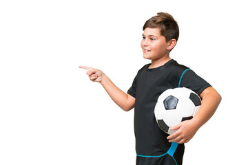 Wall Mural - Little caucasian football player kid over isolated chroma key background pointing finger to the side and presenting a product