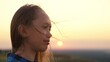 © Валерий Зотьев - beautiful girl with long hair background sunset. woman's dream. girl prays at sunset. millennial traveler. long hair girl traveler at sunset sky. summer vacation outdoor dawn. female dream concept