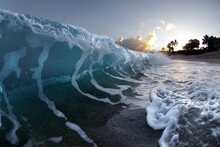 A Foam Wave Breaking Towards Shore On Oahu.