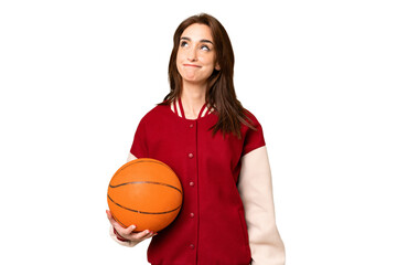 Canvas Print - Young basketball player woman over isolated chroma key background and looking up