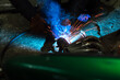 © yurii oliinyk - welder performs welding works of metal structures for custom cars