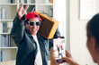 © Nattakorn - Funny Senior Asian man dj tiktoker created his dancing video by smartphone camera. To share video on social media application