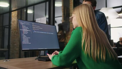 Young Blonde Woman Working As Programmer And Junior Data Scientist In Modern Office of IT-Company