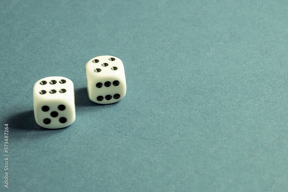 Random number generator. Two white dice with numerical values lie in a ...