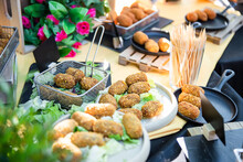 All Kinds Of Appetizers, Tapas, Canapés, Cold Meats, Cheeses And Vegetables At An Event, Wedding, Cocktail, Waiter Serving Guests.