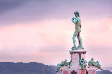 Florence, Italy sunrise at Piazzale Michelangelo with David replica statue at Michelangelo square against blue sky