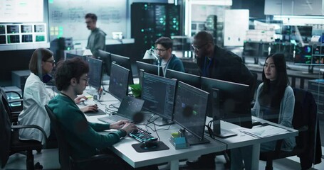 Group of Empowered Multicultural Men and Women Working in a Research Center, Using Computers to Run Advanced Software, Develop Artificial Intelligence Interface and Cloud Computing Blockchain