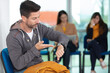 © auremar - impatient man in waiting room checking his watch