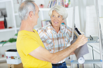 elderly couple with renovation tools