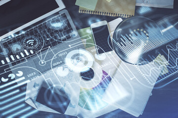 Fototapete - Technology hologram drawing over computer on the desktop background. Top view. Double exposure. Tech concept.