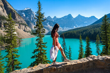 young girl enjoying moraine lake beautiful scenery. banff national park nature landscape. canadian r