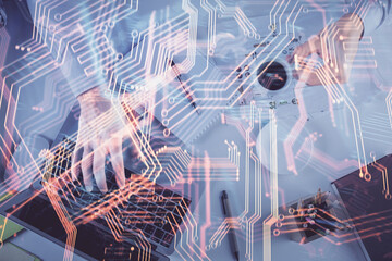 Fototapete - Double exposure of man's hands typing over computer keyboard and tech theme hologram drawing. Top view. Technology concept.