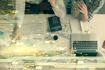 Fototapete - Double exposure of man and woman working together and data theme hologram drawing. Computer background. Top View.