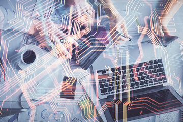 Fototapete - Double exposure of man and woman working together and technology theme drawing. Computer background. Top View. High tech concept.
