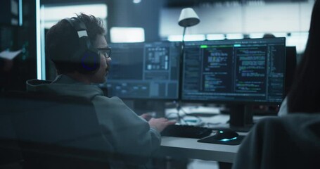 Group of Empowered Multicultural Men and Women Working in a Research Center, Using Computers to Run Advanced Software and Develop Artificial Intelligence Interface. Footage from the Back