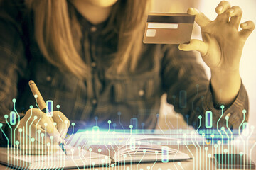 Fototapete - Double exposure of woman on-line shopping holding a credit card and data theme hologram drawing. E-commerce concept.