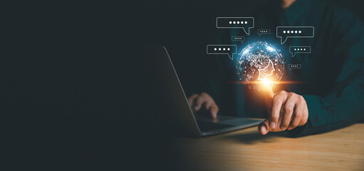 Chatbot chat AI concept, artificial intelligence Businessman using AI smart robot technology inputting commands to analyze data and build something. future technology changes.