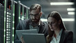 © LAYHONG - Serious business team working on digital tablet in server room at night. Generative AI