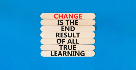 Wall Mural - Change symbol. Concept words Change is the end result of all true learning on wooden stick. Beautiful blue table blue background. Copy space. Motivational business change result concept.
